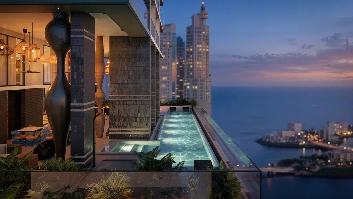 Rooftop infinity pool overlooking Panama City skyline and waterfront views at a luxury residence